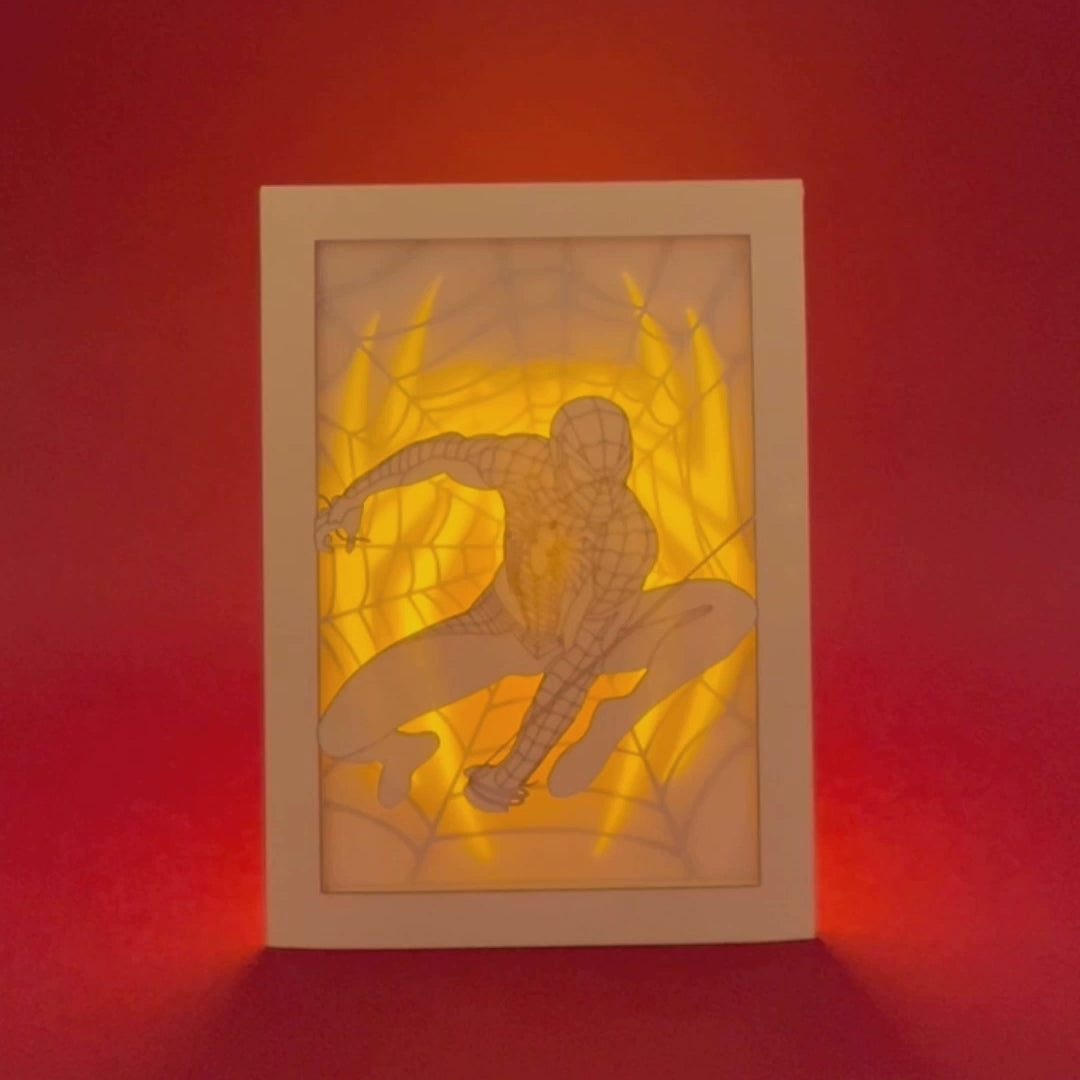 Spider-Man swinging on web with logo and intricate web design